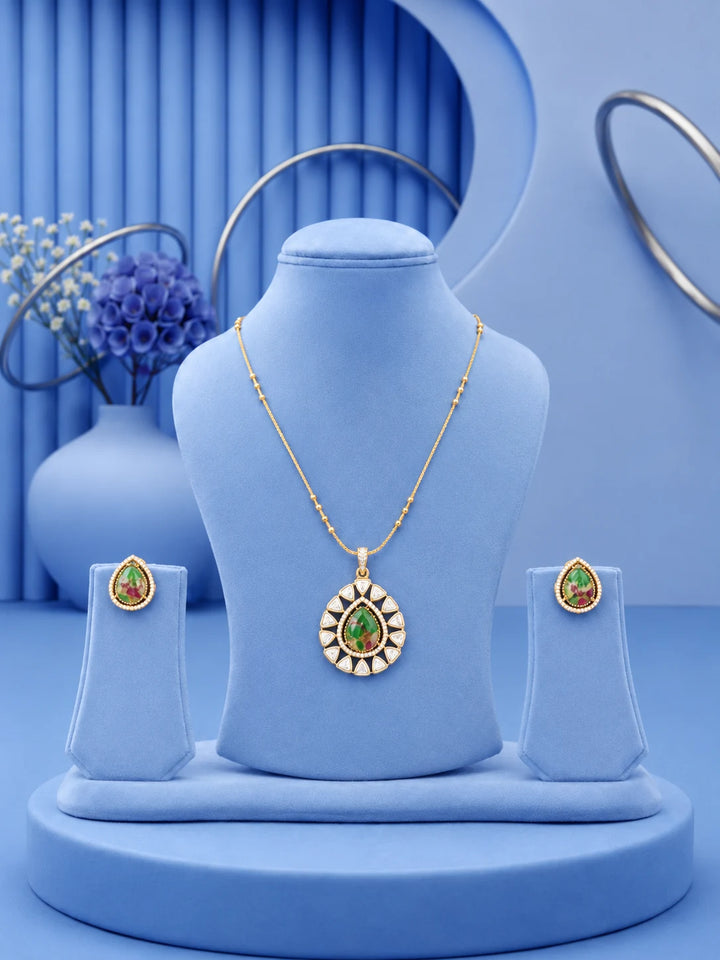 Teardrop Stone Pendant Set with green center stone and matching gold-toned earrings