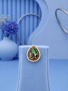 Teardrop Stone Pendant Set with green center stone and matching gold-toned earrings