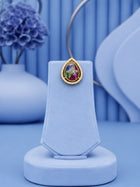 Teardrop Stone Pendant Set with multicolor center stone and matching gold-toned earrings