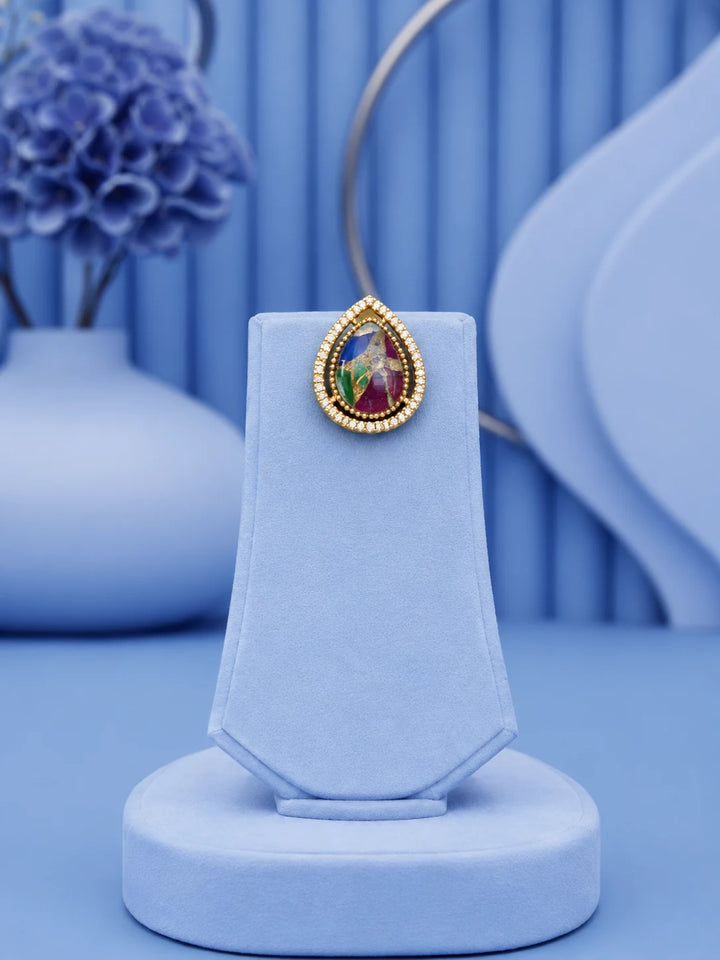 Teardrop Stone Pendant Set with multicolor center stone and matching gold-toned earrings