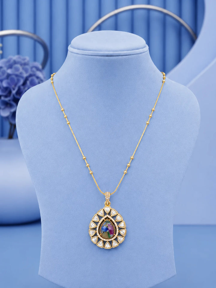 Teardrop Stone Pendant Set with multicolor center stone and matching gold-toned earrings