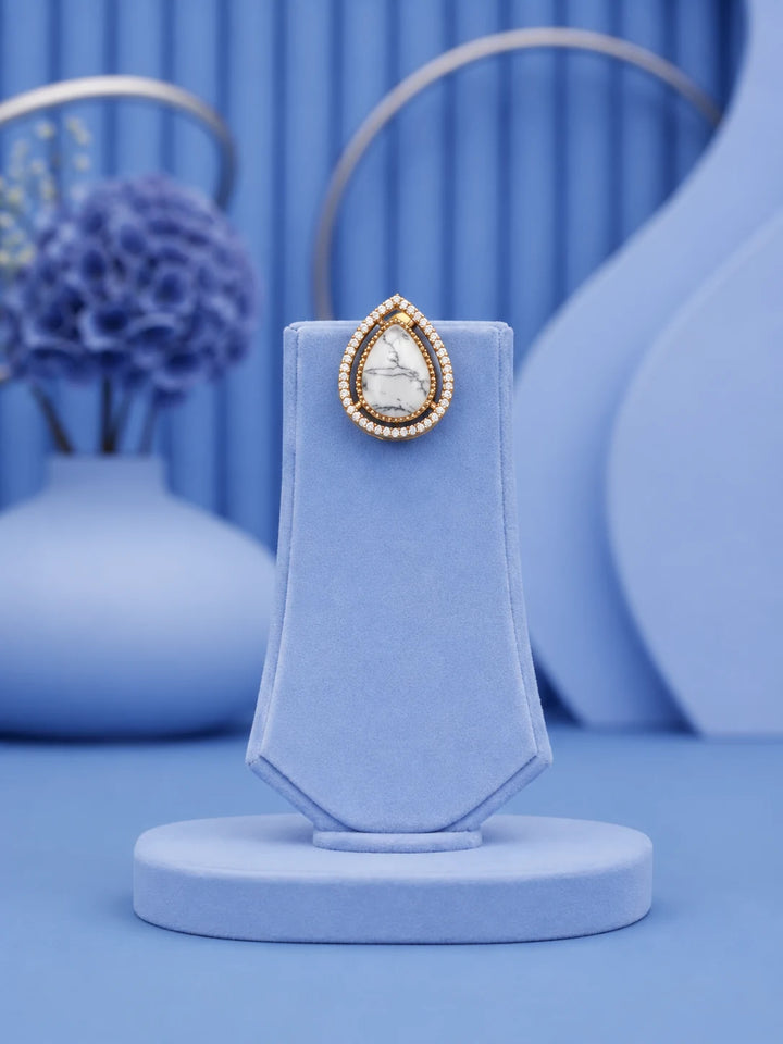 Teardrop Stone Pendant Set with white stone pendant and matching gold-toned earrings
