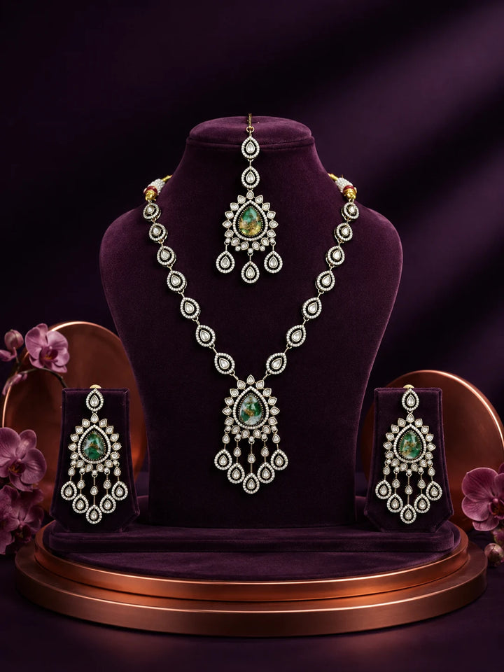 Bridal Kundan Necklace Set with green teardrop center stones, chandelier pendant, matching earrings, and maang tikka