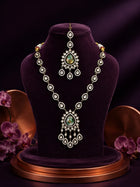 Bridal Kundan Necklace Set with green teardrop center stones, chandelier pendant, matching earrings, and maang tikka