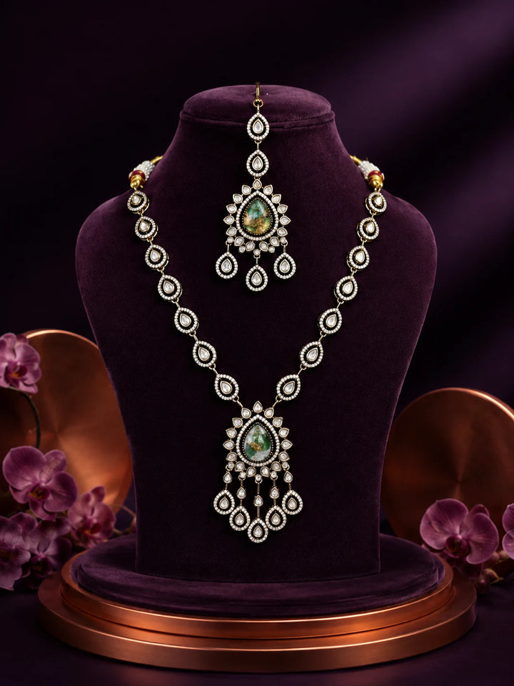 Bridal Kundan Necklace Set with green teardrop center stones, chandelier pendant, matching earrings, and maang tikka