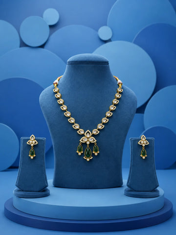 Kundan Drop Necklace Set with green teardrop drops, white kundan-style stones, gold-toned necklace, and matching earrings