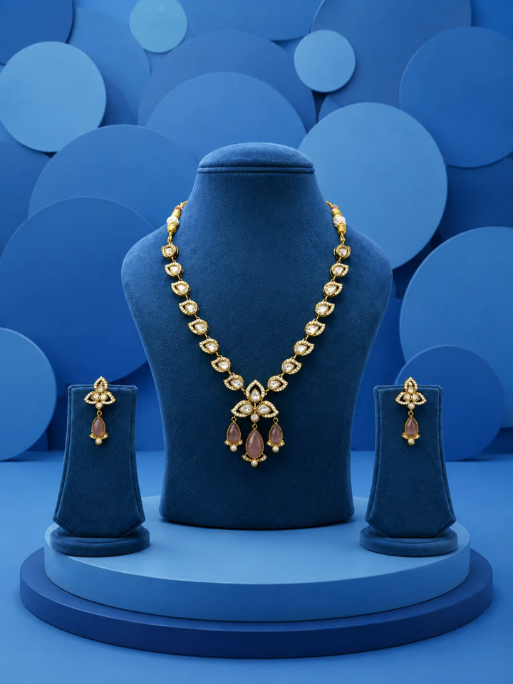 Kundan Drop Necklace Set with green teardrop drops, white kundan-style stones, gold-toned necklace, and matching earrings