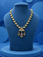 Kundan Drop Necklace Set with green teardrop drops, white kundan-style stones, gold-toned necklace, and matching earrings