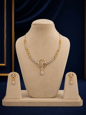 Spiral Drop Necklace Set with gold-toned spiral motif, white crystal drop stones, linked circle details, and matching earrings