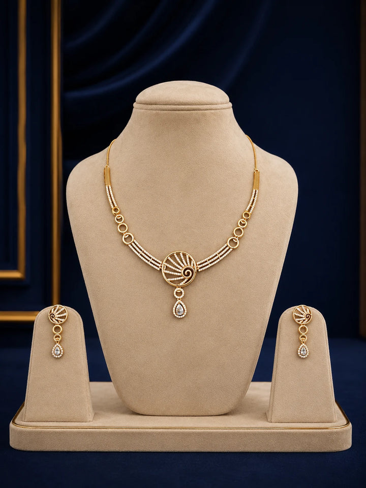 Spiral Drop Necklace Set with gold-toned spiral motif, white crystal drop stones, linked circle details, and matching earrings