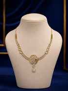 Spiral Drop Necklace Set with gold-toned spiral motif, white crystal drop stones, linked circle details, and matching earrings