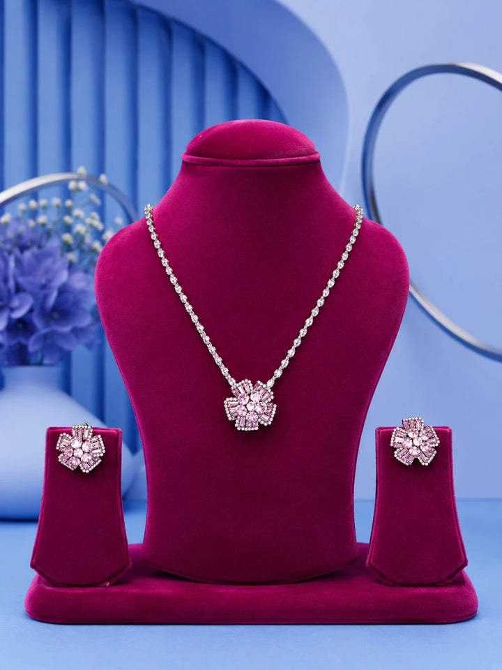 Pink Floral Necklace Set with silver-toned crystal chain, pink floral pendant, and matching stud earrings