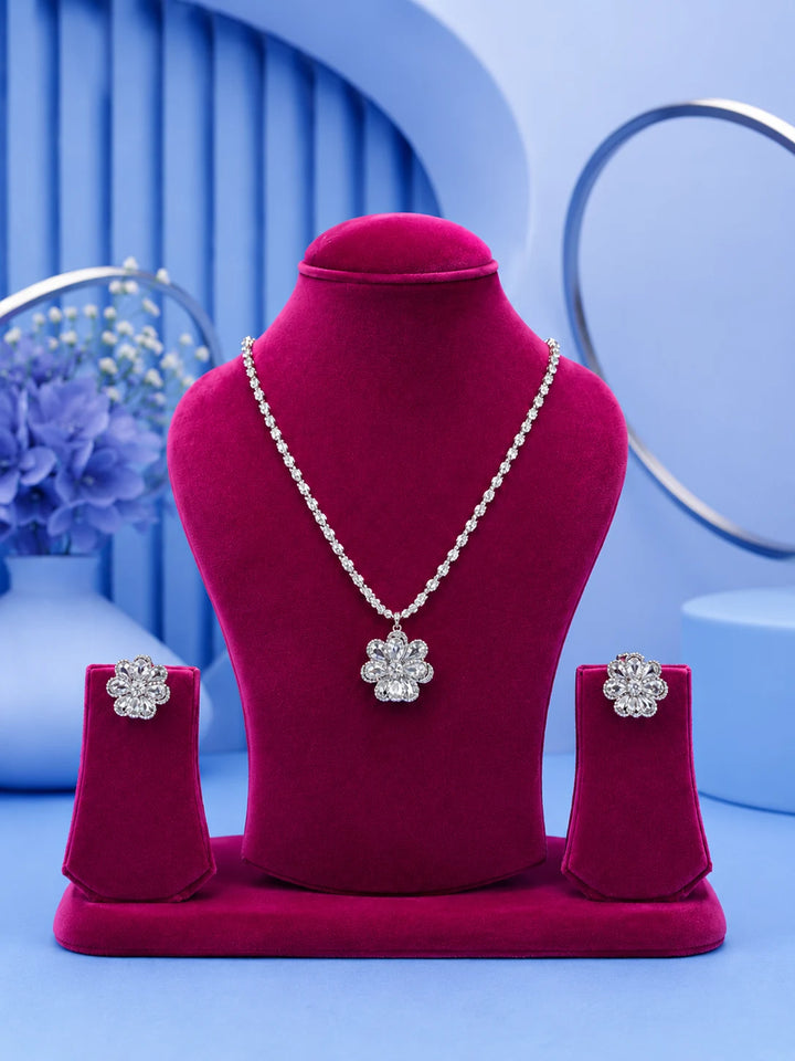 White Floral Necklace Set with silver-toned crystal chain, floral pendant, and matching stud earrings