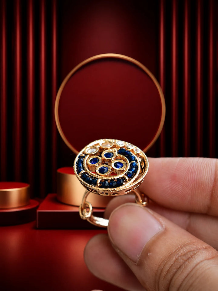 Blue Beaded Kundan Ring with gold-toned round design, deep blue bead accents, white kundan-style stones, and crystal detailing