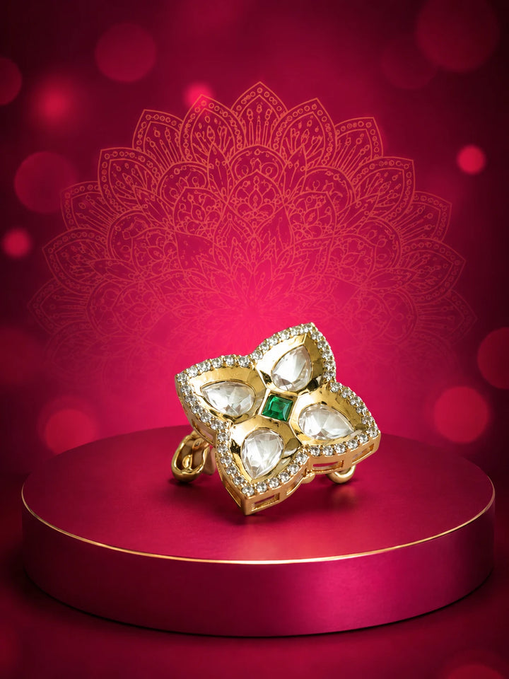 Floral Kundan Ring with green square center stone, gold-toned four-petal design, white kundan-style stones, and crystal border