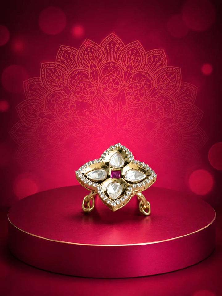 Floral Kundan Ring with red square center stone, gold-toned floral design, white kundan-style stones, and crystal border