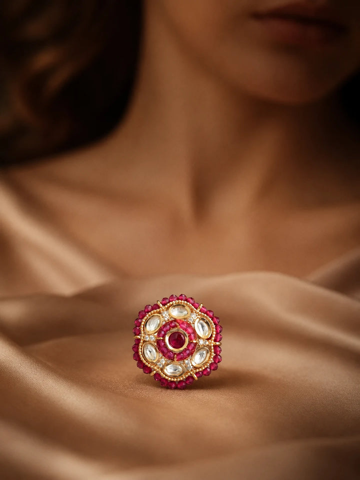 Beaded Kundan Ring with red bead border, gold-toned round design, red center stone, white kundan-style stones, and crystal accents