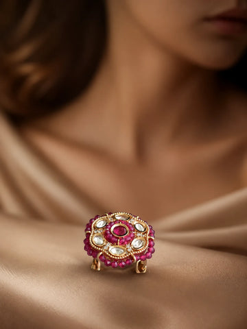 Beaded Kundan Ring with red bead border, gold-toned round design, red center stone, white kundan-style stones, and crystal accents