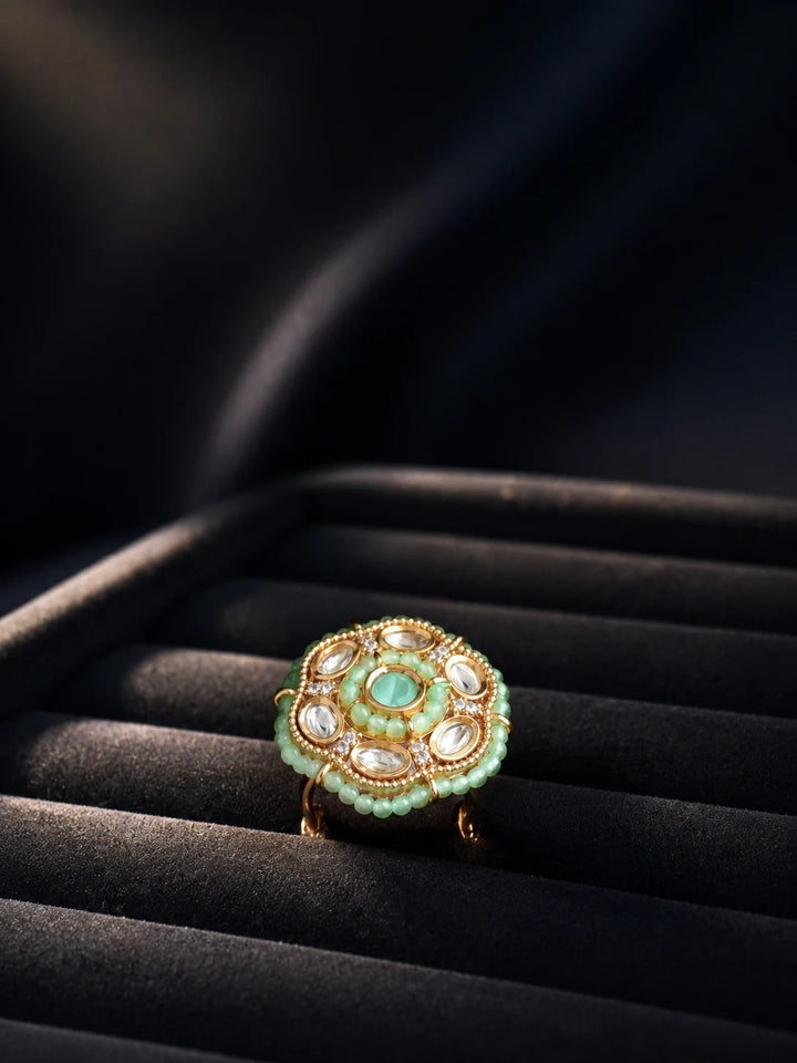 Beaded Kundan Ring with mint bead detailing, gold-toned finish, white kundan-style accents, and round statement design