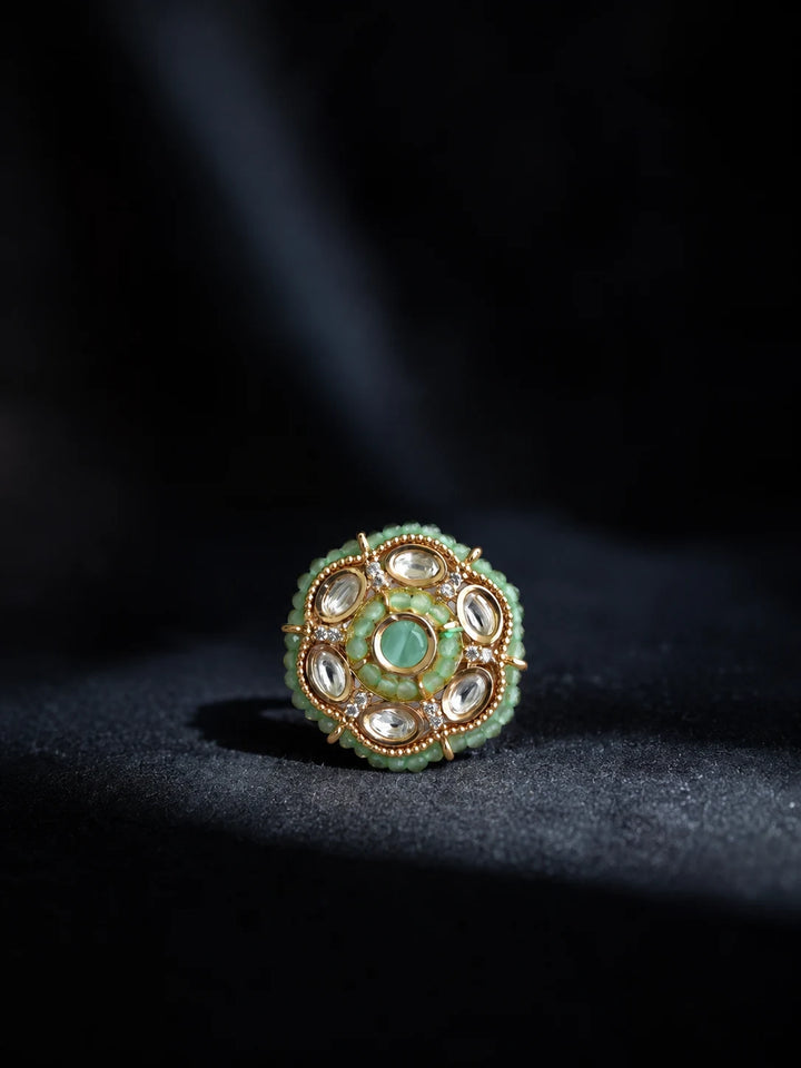 Beaded Kundan Ring with mint bead detailing, gold-toned finish, white kundan-style accents, and round statement design