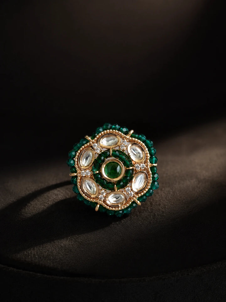 Beaded Kundan Ring with dark green bead border, gold-toned round design, white kundan-style stones, and green center stone