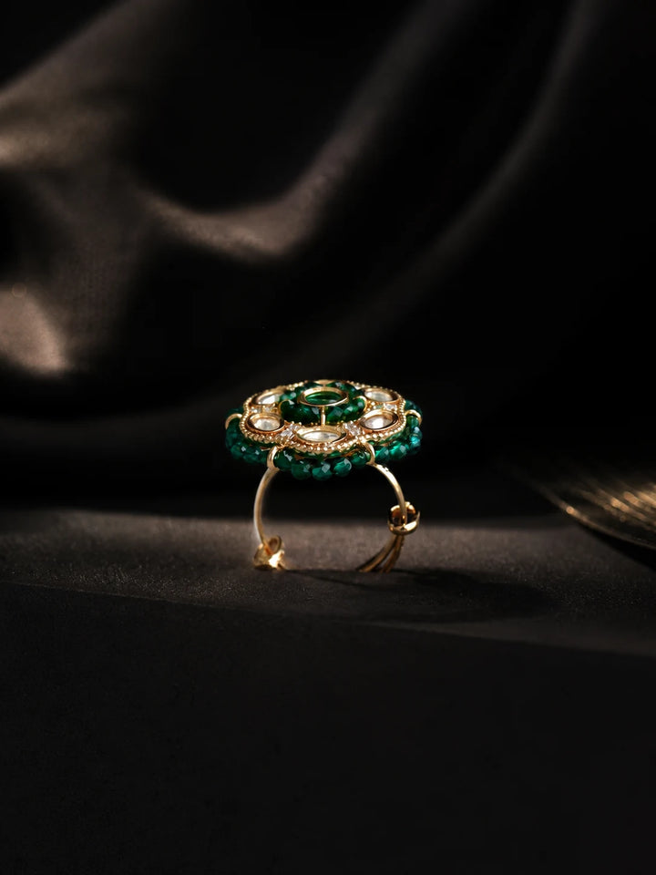 Beaded Kundan Ring with dark green bead border, gold-toned round design, white kundan-style stones, and green center stone