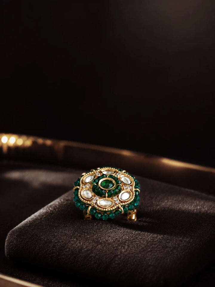 Beaded Kundan Ring with dark green bead border, gold-toned round design, white kundan-style stones, and green center stone