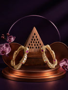 Pink Kundan Bangles with gold-toned kada design, pink stones, white kundan-style accents, and ornate filigree work