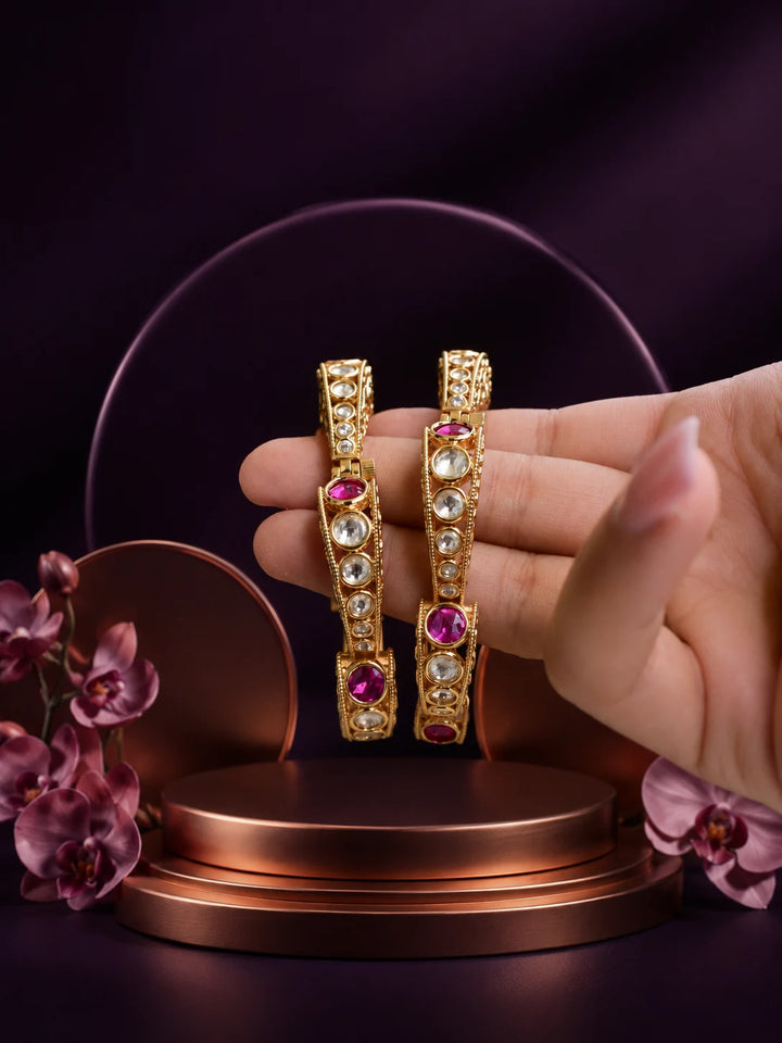 Pink Kundan Bangles with gold-toned kada design, pink stones, white kundan-style accents, and ornate filigree work