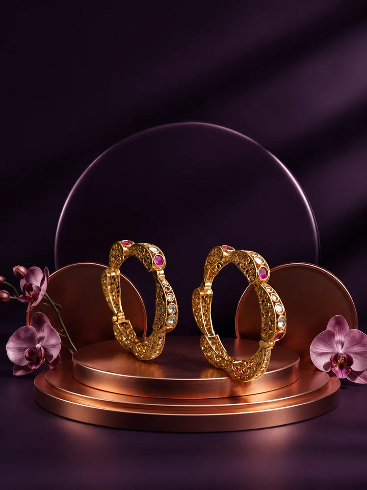 Pink Kundan Bangles with gold-toned kada design, pink stones, white kundan-style accents, and ornate filigree work