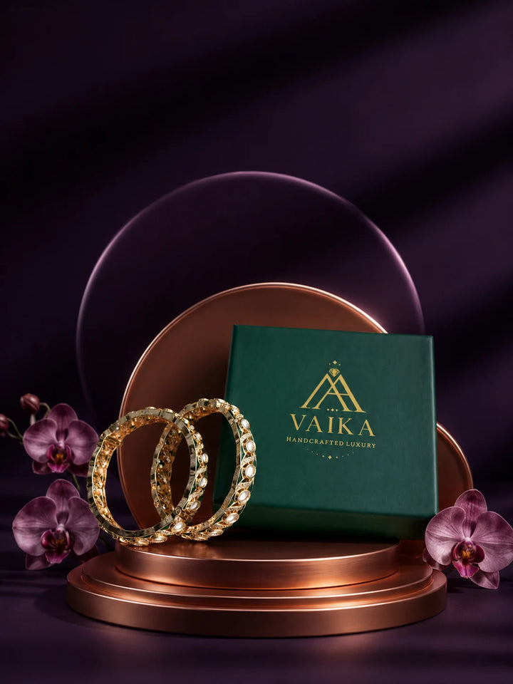 Green Kundan Bangles with gold-toned kada design, white kundan-style stones, green meenakari accents, and linked oval motifs