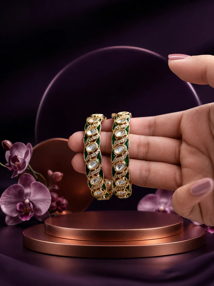 Green Kundan Bangles with gold-toned kada design, white kundan-style stones, green meenakari accents, and linked oval motifs