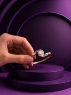 Crystal Kundan Bracelet with pink stone accents, gold-toned curved kada design, and clear kundan-style detailing