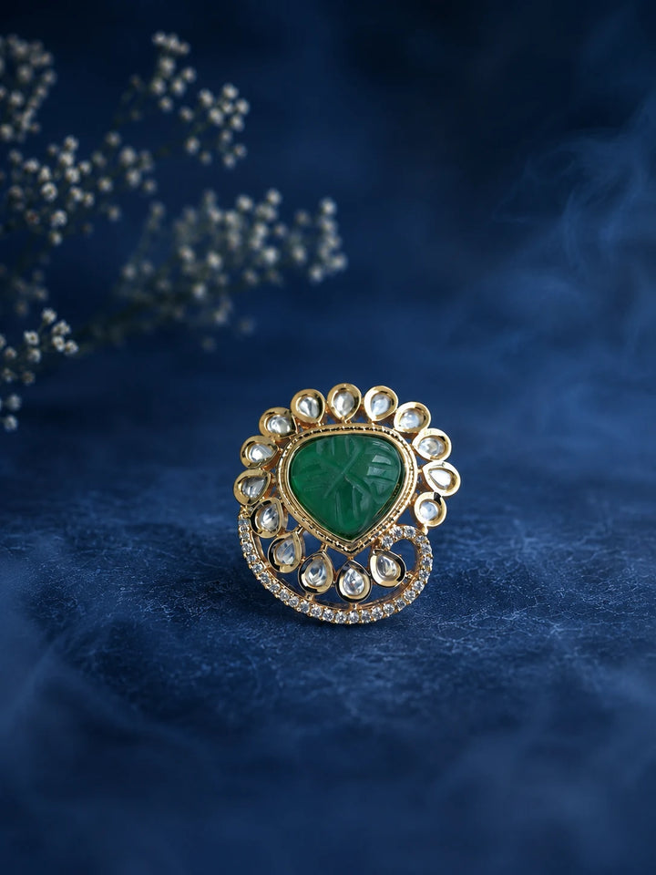 Heart Kundan Ring with green heart center stone, gold-toned layered design, white kundan-style accents, and crystal border