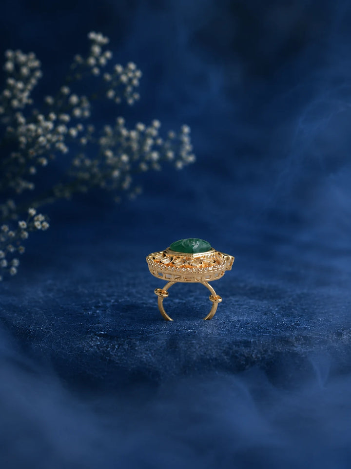 Heart Kundan Ring with green heart center stone, gold-toned layered design, white kundan-style accents, and crystal border