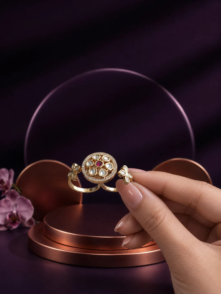 Floral Kundan Ring with pink center stone, gold-toned round design, white kundan-style accents, and side floral motifs