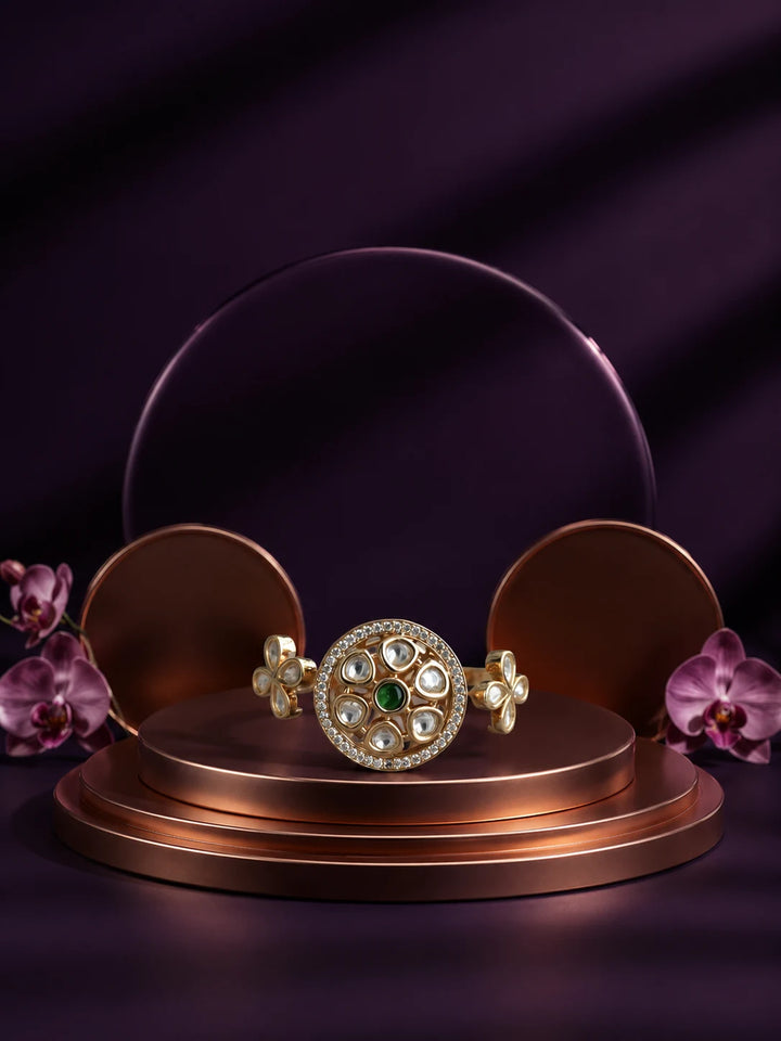 Floral Kundan Ring with green center stone, gold-toned two-finger design, white kundan-style accents, and floral side details