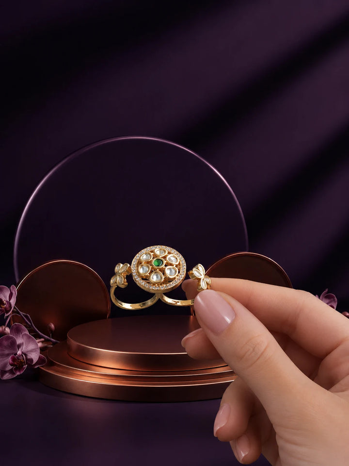 Floral Kundan Ring with green center stone, gold-toned two-finger design, white kundan-style accents, and floral side details
