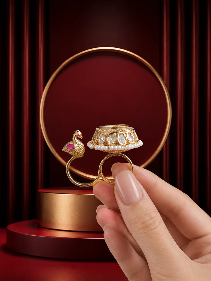 Peacock Kundan Ring with gold-toned bird motif, pearl-style detailing, white kundan-style stones, and round statement top