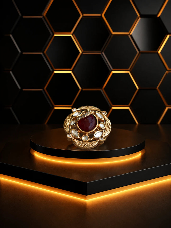 Red Kundan Ring with gold-toned round design, oval red center stone, white kundan-style accents, and ornate detailing