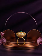 Green Kundan Ring with gold-toned round design, green center stone, white kundan-style accents, and crystal detailing