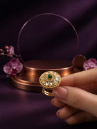 Green Kundan Ring with gold-toned round design, green center stone, white kundan-style accents, and crystal detailing