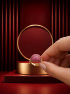 Pink Crystal Ring with gold-toned band, pavé-style magenta crystal top, and clear side accents