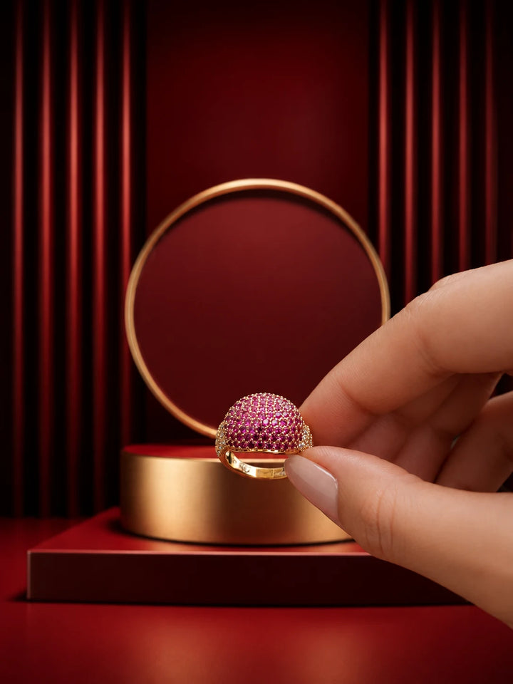 Pink Crystal Ring with gold-toned band, pavé-style magenta crystal top, and clear side accents