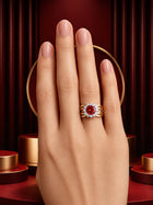 Red Crystal Ring with gold-toned halo design, bold red center stone, clear crystal-style accents, and broad statement band